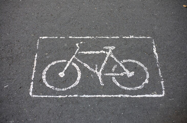 Bike lane sign with a frame on asphalt