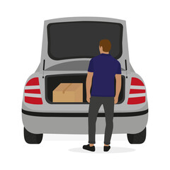 Cardboard box in open car trunk and man on white background