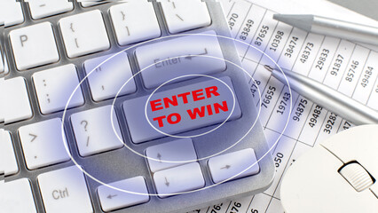 ENTER TO WIN text on keyboard wirh chart and pencil