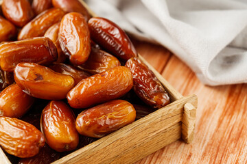 juicy royal dates on a wooden rustic background