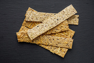 diet crispy bread on a black stone background