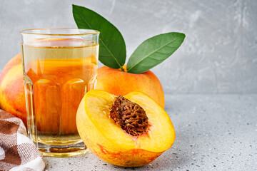 fresh peach cider on a gray stone background