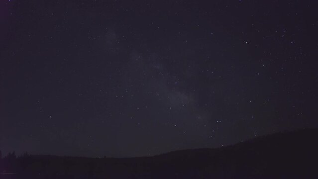 time lapse of stars and milky way galaxy over Donner lake in Truckee California on crystal clear summer night very clear sky shooting stars in 4k