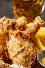 crispy deep-fried chicken drumsticks on a black background