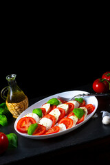 Tomato with mozzarella and basil