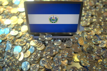 Laptop with flag of El Salvador and pile of bitcoins. Cryptocurrency mining and national regulations concepts, 3d rendering - obrazy, fototapety, plakaty