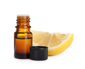 Bottle of citrus essential oil and cut fresh lemon isolated on white
