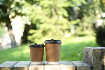 Paper cups on street outdoors. Takeaway drink