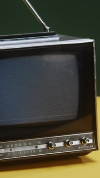 A close up of a retro, vintage tv 