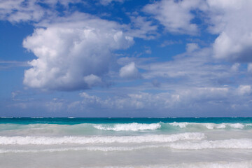 Travel background with Caribbean sea and clouds sky.
