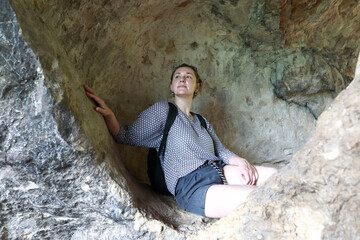 Woman in grotto on Una-Koz Ridge