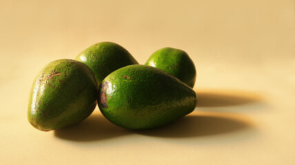 fresh raw avocados on beige background