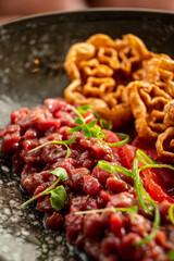 beef tartare on the dark plate