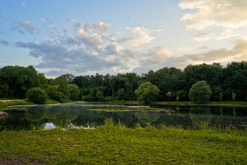 Fototapeta na wymiar Nature landscape with lake and trees on sunset light.