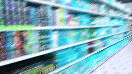 Abstract blur image of supermarket background. Defocused shelves with fresh products. Grocery shopping. Store. Retail industry. Rack. Discount. Inflation and food crisis concept. Aisle. Recession