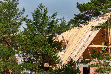 Fototapeta na wymiar Wooden beams for house roof construction
