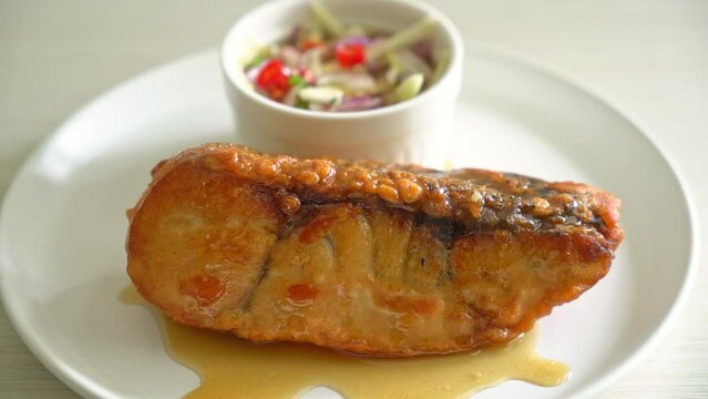 fried snapper fish with fish sauce and spicy salad - Asian food style