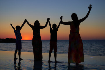 group of people at sunset