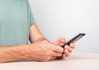 Man hands closeup texting message at smartphone. Male using messenger. Device for social communication