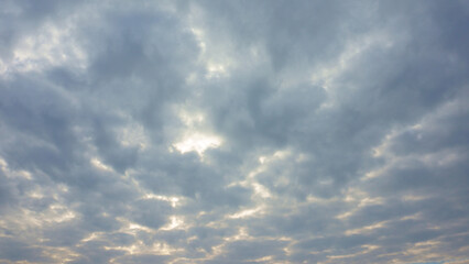 Obraz premium Sunlight breaking through dark clouds
