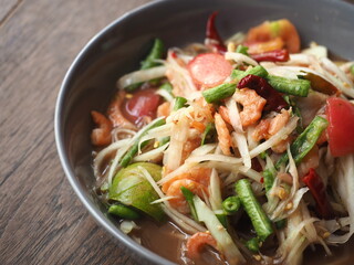 Som Tum, Thai Isaan or Northeastern style spicy green papaya salad