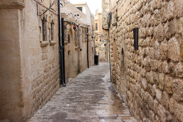 Fototapeta na wymiar Old stony historical street in Mardin City 