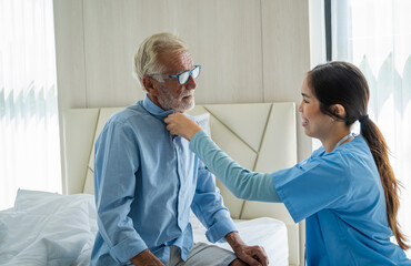 Nurses take care of senior man at home,Medical insurance service concept.