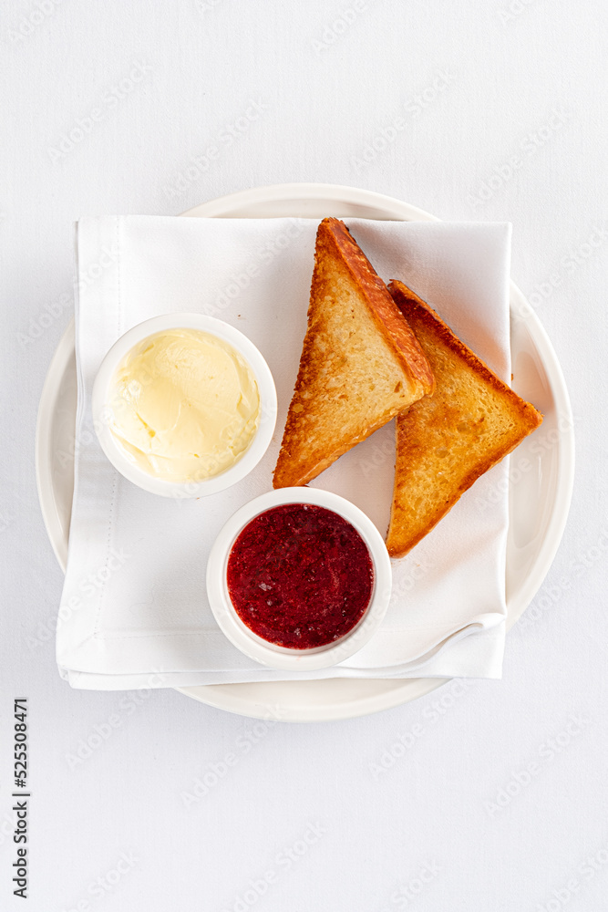 Wall mural toasted bread, strawberry marmalade and butter.