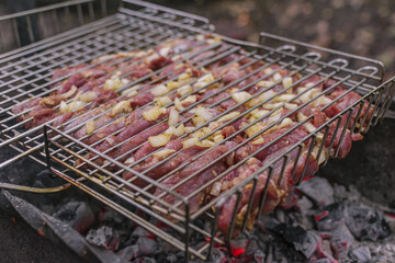 Delicious meat cooked in a grill over burning coals