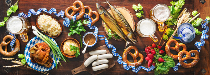 Festive served table with Bavarian specialities. Oktoberfest menu - obrazy, fototapety, plakaty