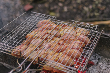 Delicious meat cooked in a grill over burning coals