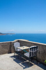 Fototapeta premium coffee table with sea view in Ischia Ponte