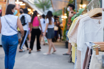woman clothes on hangers for sale in market Thailand cheap clothes