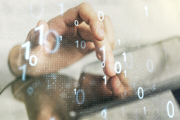 Creative abstract binary code sketch and hand working with a digital tablet on background, hacking...