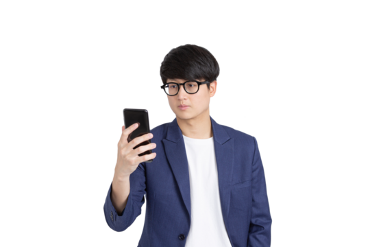 Image of handsome asian young adult man in glasses holding and looking at cellphone on transparent as png