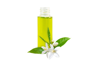 Neroli essential oil in the bottle and orange tree fragrant flowers, leaves and buds isolated...