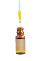Oil in the dark amber glass bottle and dropper isolated transparent png. 
