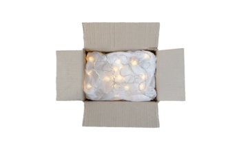 Opened cardboard box with crumpled wrapping paper and lights garland. Holiday online shopping concept. Top view. Isolated transparent png.