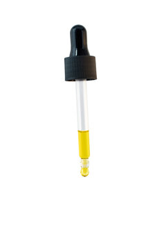 Oil drop in the glass dropper isolated transparent png. Pipette liquid dosage. 