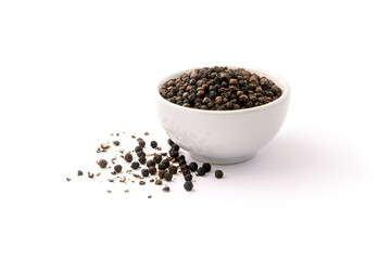 Black pepper or peppercorns in ceramic bowl isolated on white background.