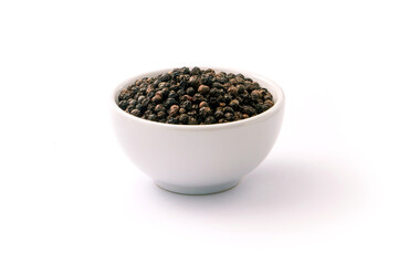 Black pepper or peppercorns in ceramic bowl isolated on white background.