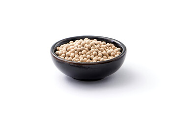 White pepper or peppercorns in ceramic bowl isolated on white background.