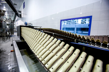 Fototapeta premium Production of plastic bottles. Factory automated industrial line for bottling