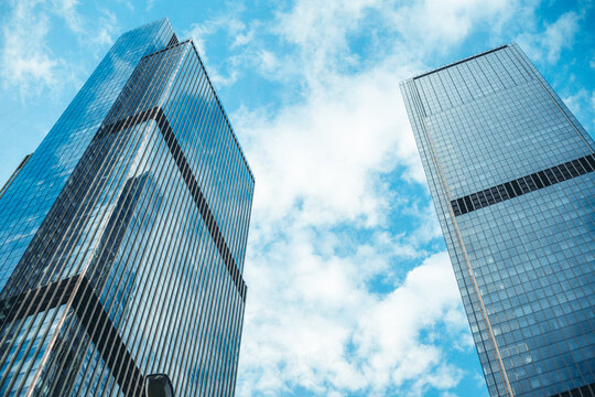 Modern skyscrapers in business district and cloudy sky