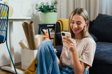 student female shopping online using smartphone