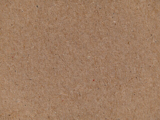Texture of brown kraft paper, paper background. Macro of a sheet of paper, background texture. Close-up paper surface structure