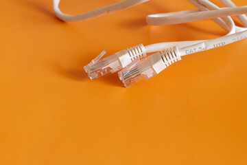 Internet cable on orange background, cable for internet connection