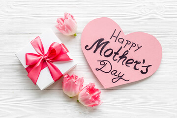 Happy Mothers day background with pink flowers, top view