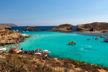 Blue Lagoon, Malta 08-04-2022 The Blue Lagoon is a popular  small bay for a day trip with shallow, azure-coloured water on the West coast of Comino island, between Malta and Gozo in the Mediterranean