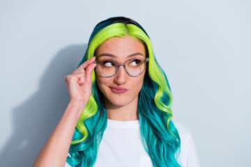 Photo of cute suspicious vibrant gradient hair girl dressed t-shirt arm spectacles looking empty...
